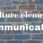 A blue-painted brick wall with the words 'Culture element: communication' superimposed in white