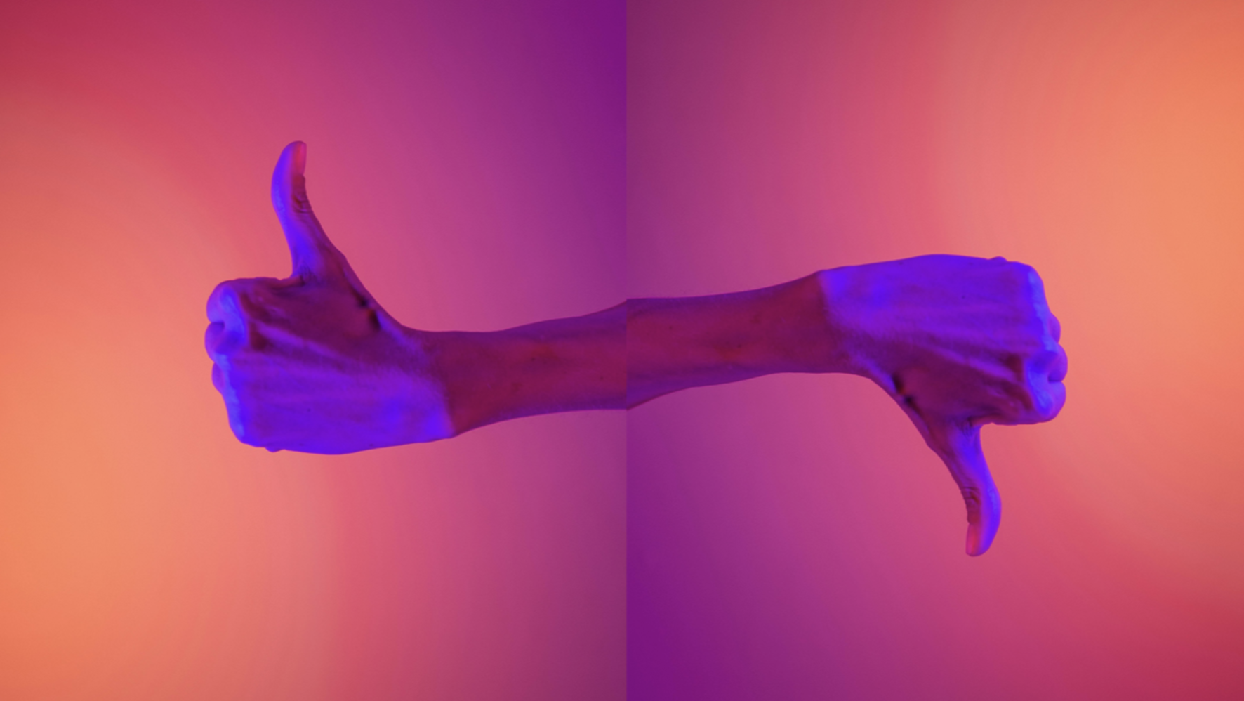 a composite image of two hands lit with purple light against an orange background. On the left, the hand is giving a "thumbs up" sign. On the right, it's "thumbs down".