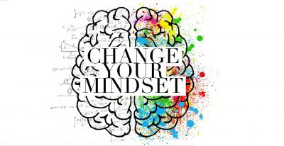 Drawing of brain, with 'Change your mindset' superimposed over it. The left side of the brain has figures and equations and symbols, the right side has splashes of colour.