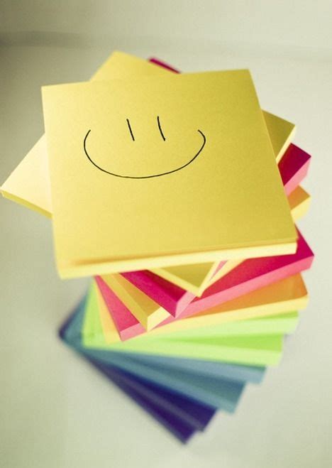 A stack of coloured Post-it(R) Note pads